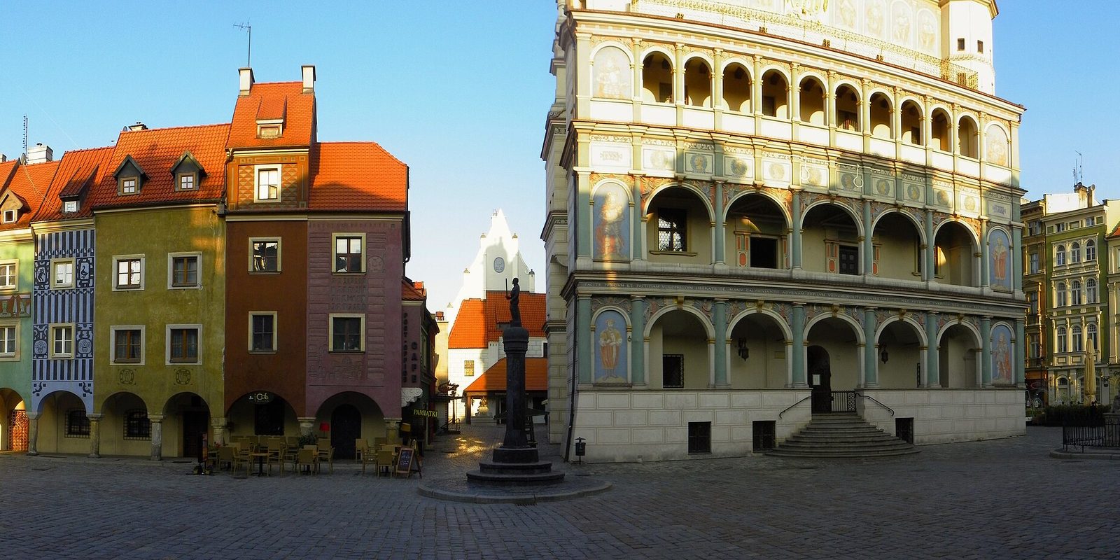 Colourful merchant houses and the arcades of the town hall on Poznań's Old Market Square