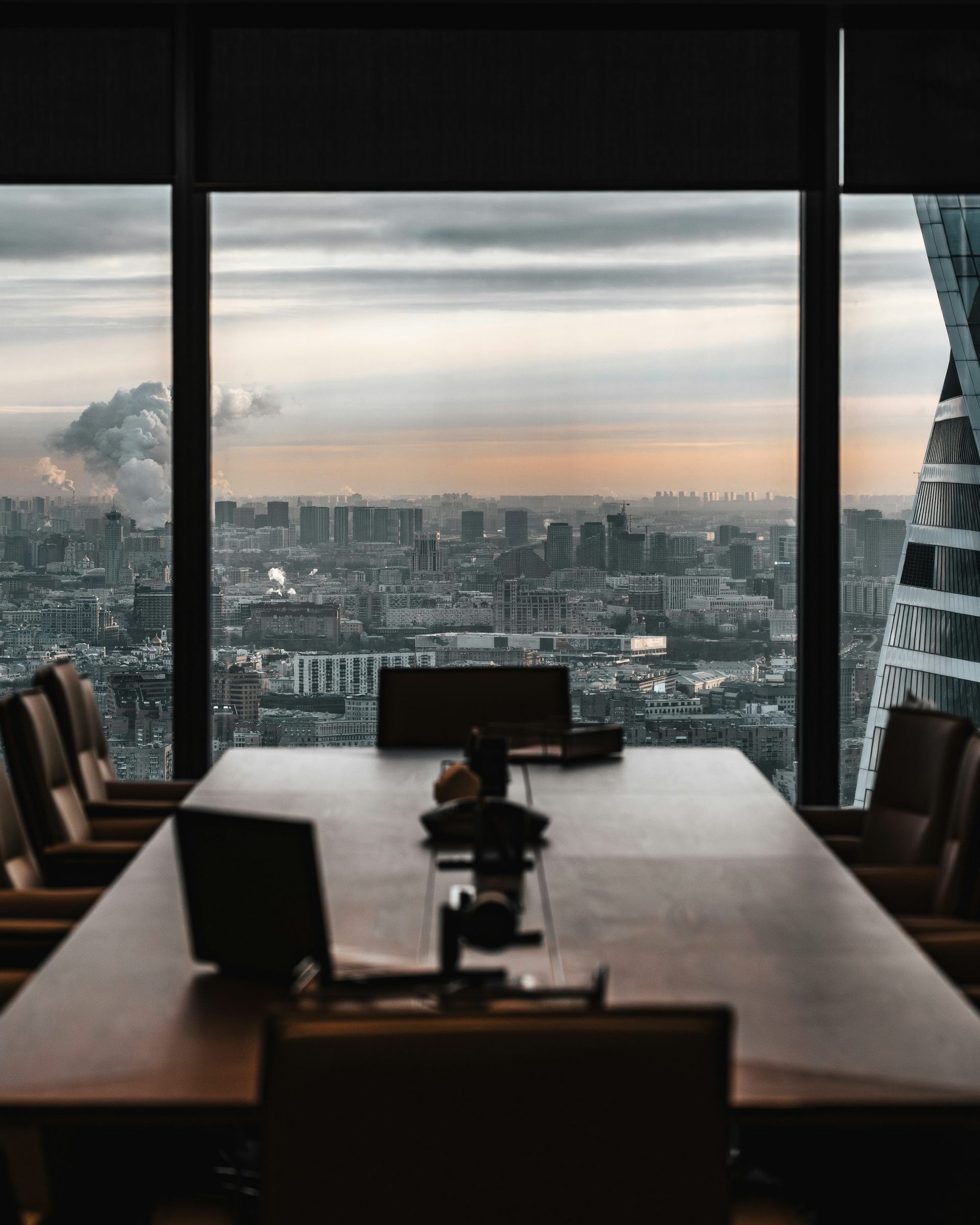 Executive boardroom with panoramic city view – premium conference transfer service